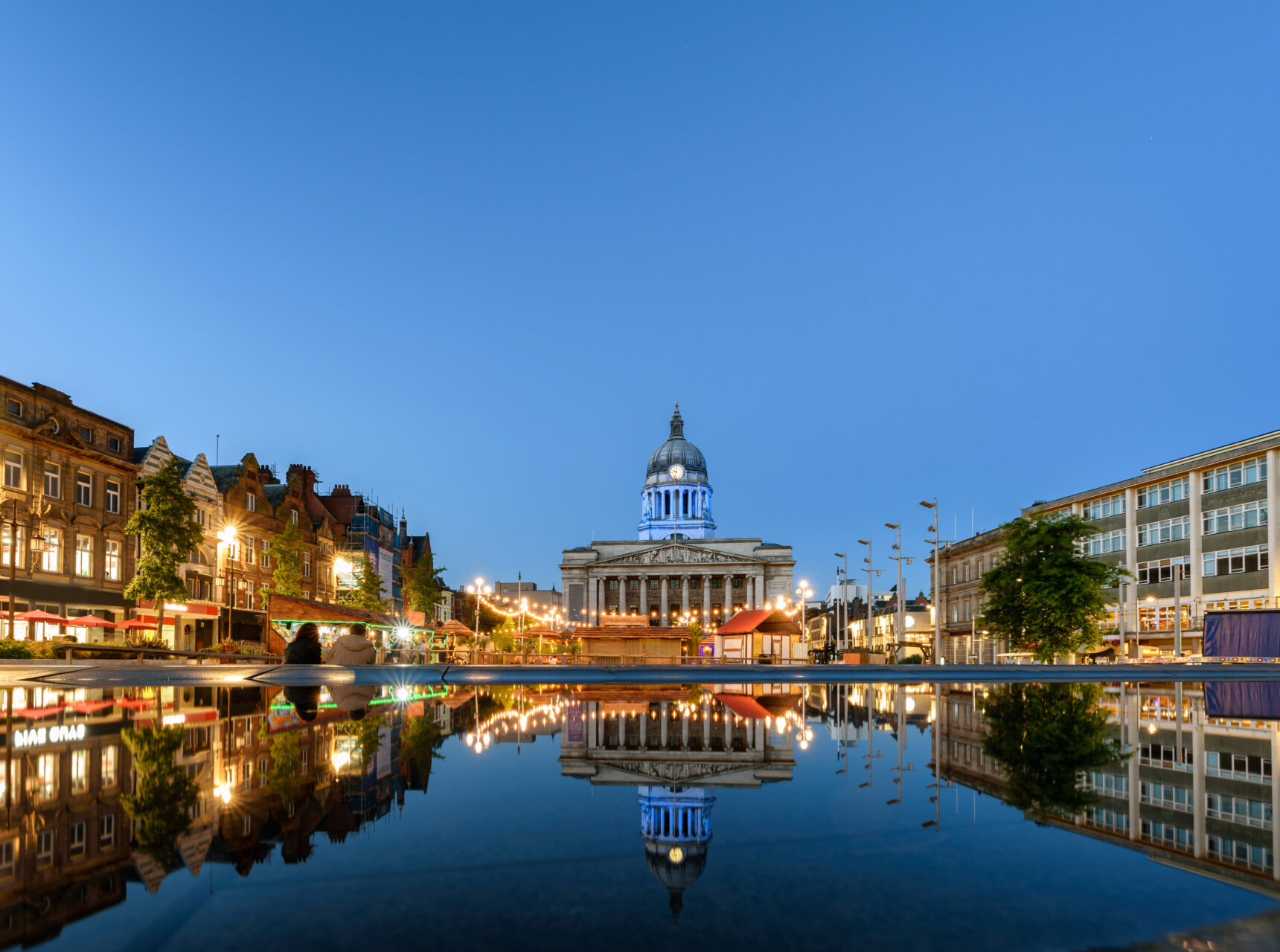 Nottingham market square with council house and new redevelopment pool with fountain in the square in Nottingham city, England.