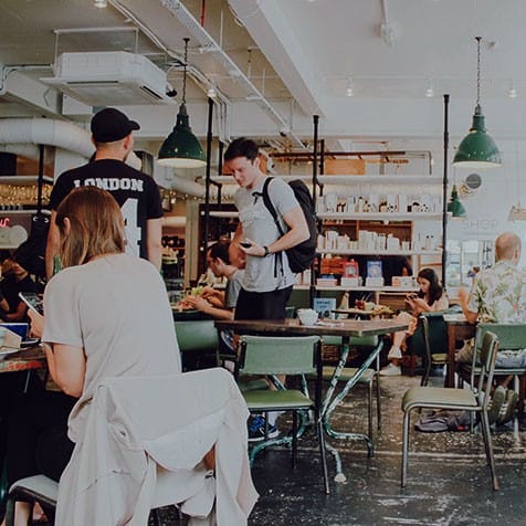 University students eating and studying at a local cafe in Leicester