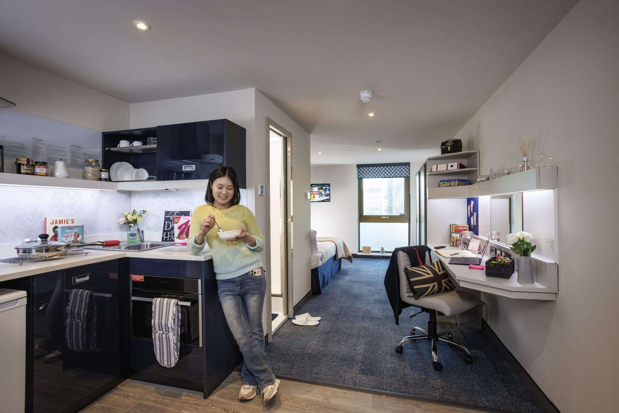 Study Inn Leeds, student accommodation in Leeds. Sapphire studio with student cooking in the kitchenette.