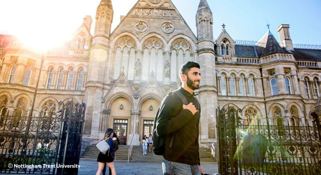 Exterior shot of the Nottingham Trent University, with students walking past its frontage