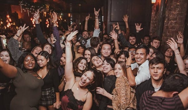 The Backroom club and bar, with happy students dancing on the dancefloor.
