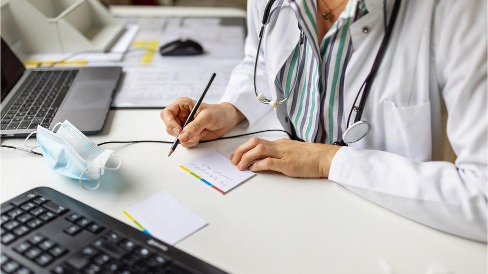 Doctor writing a note