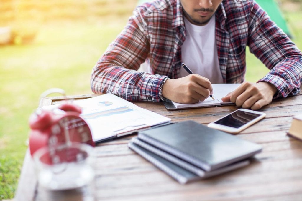 student working on financial planning, managing study expenses and personal budgeting as part of student life in Bristol