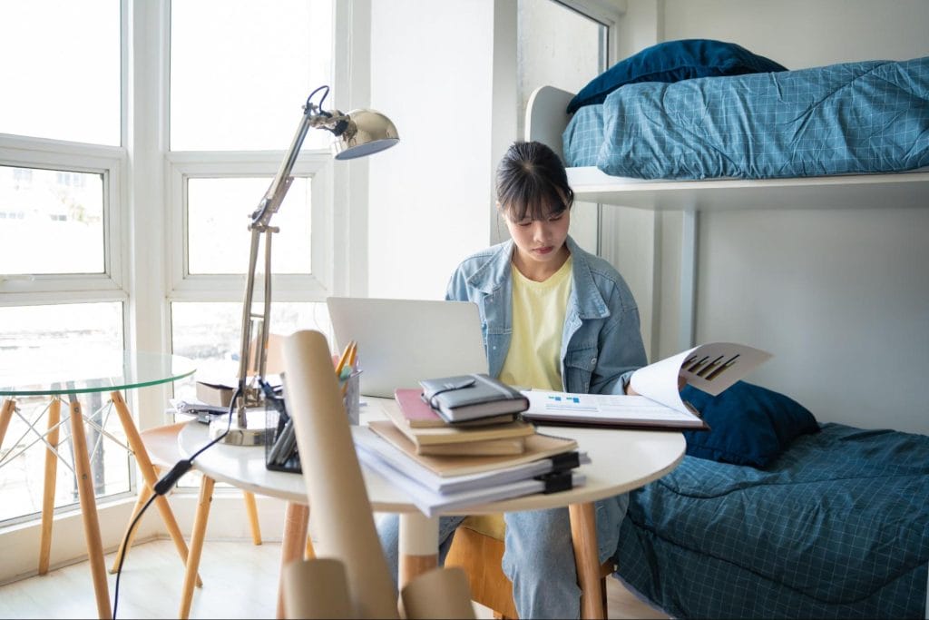 student studying in a fully furnished room at Talbot Street, Nottingham accommodation.