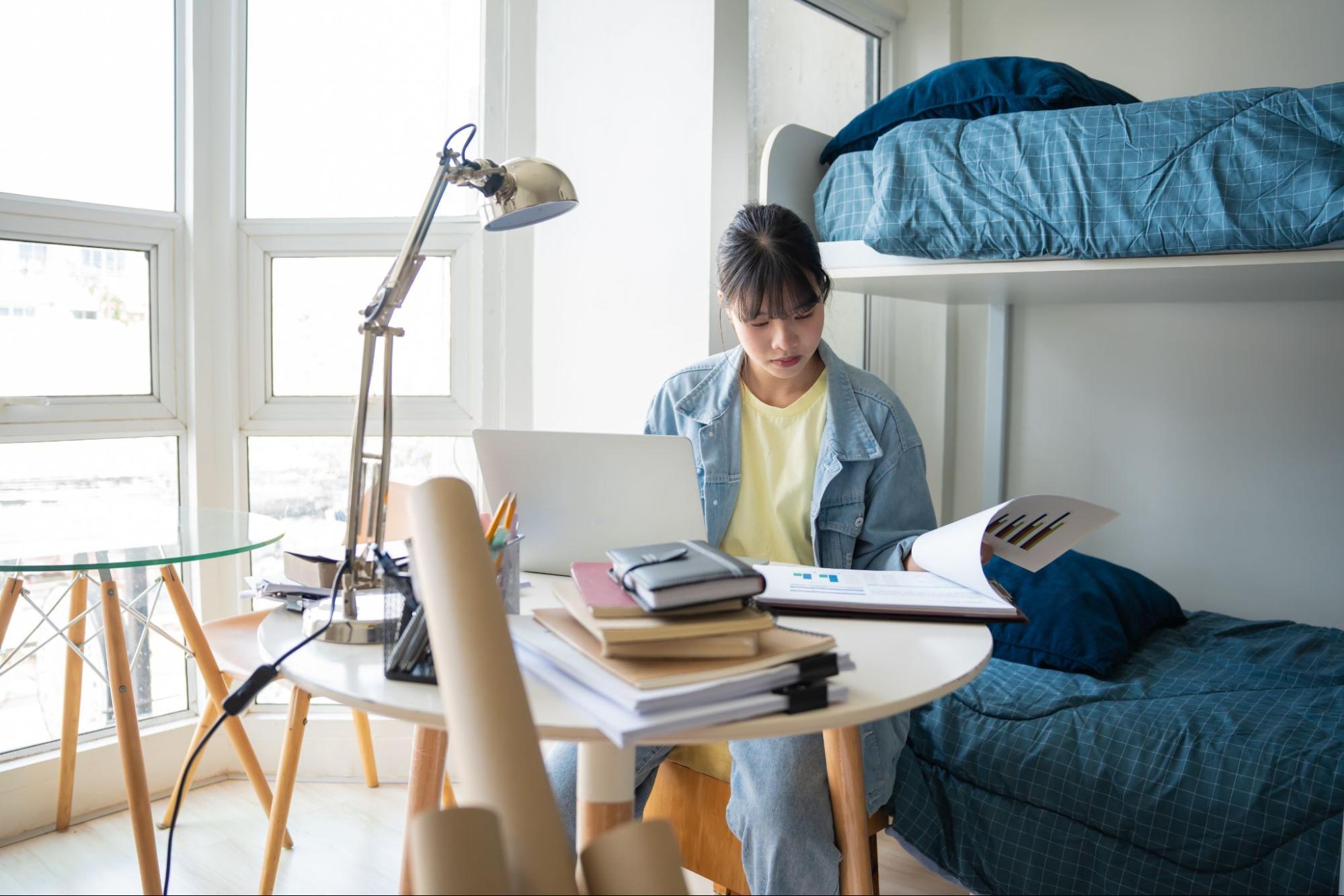 student studying in a fully furnished room at Talbot Street, Nottingham accommodation.