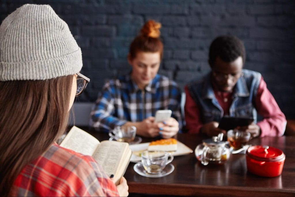 Student enjoying a productive study session in a Loughborough café