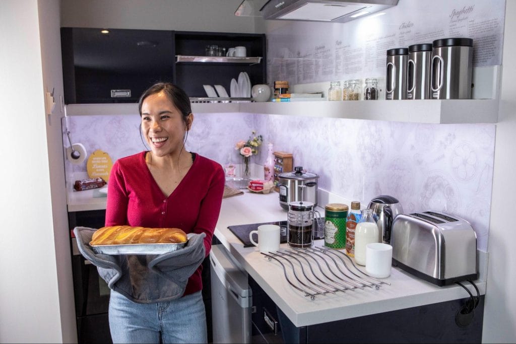 Resident baking in a modern kitchen at Student Accommodation in Leicester at Study Inn

