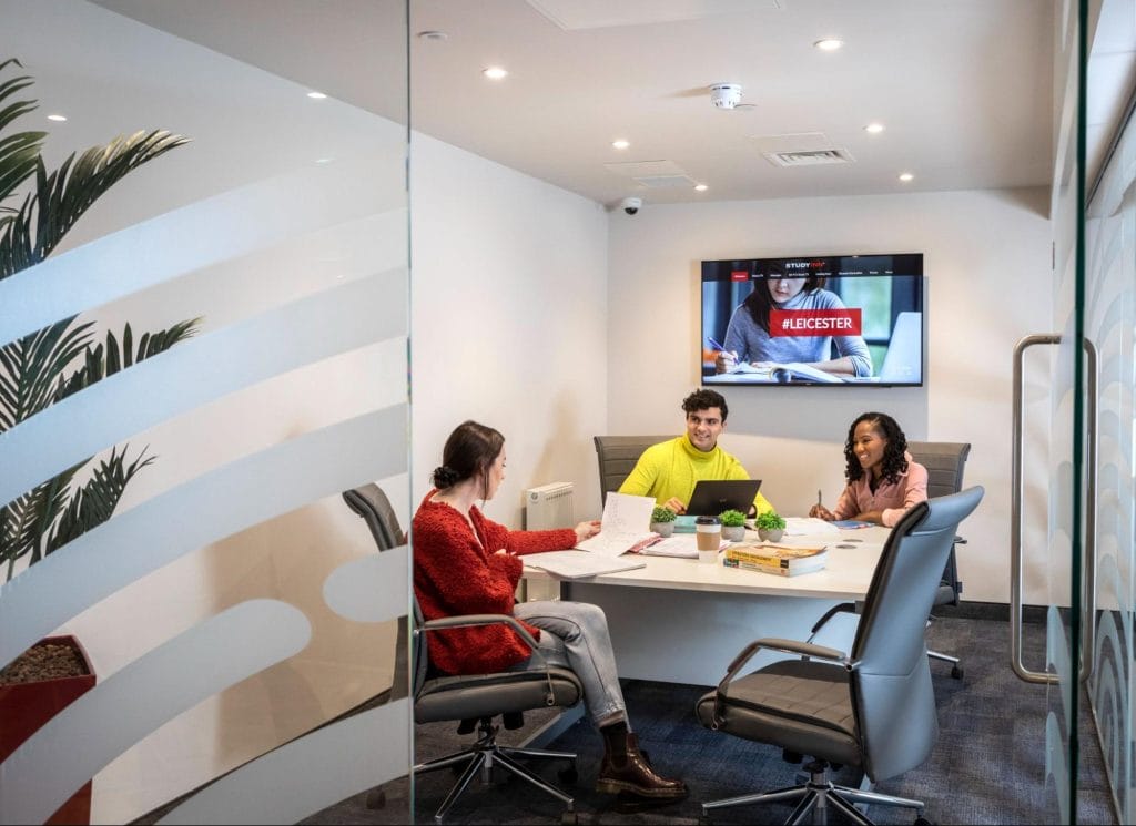 Students collaborating in a private study room at Student Accommodation in Leicester at Study Inn