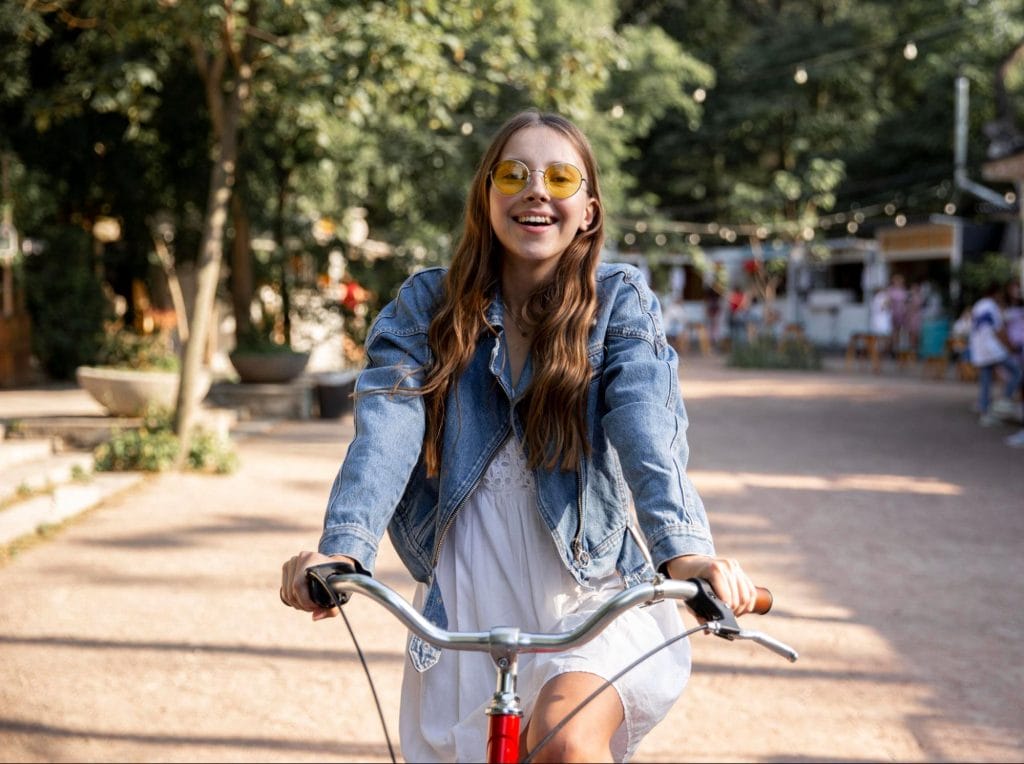 Female student cycling near student accommodation in Exeter