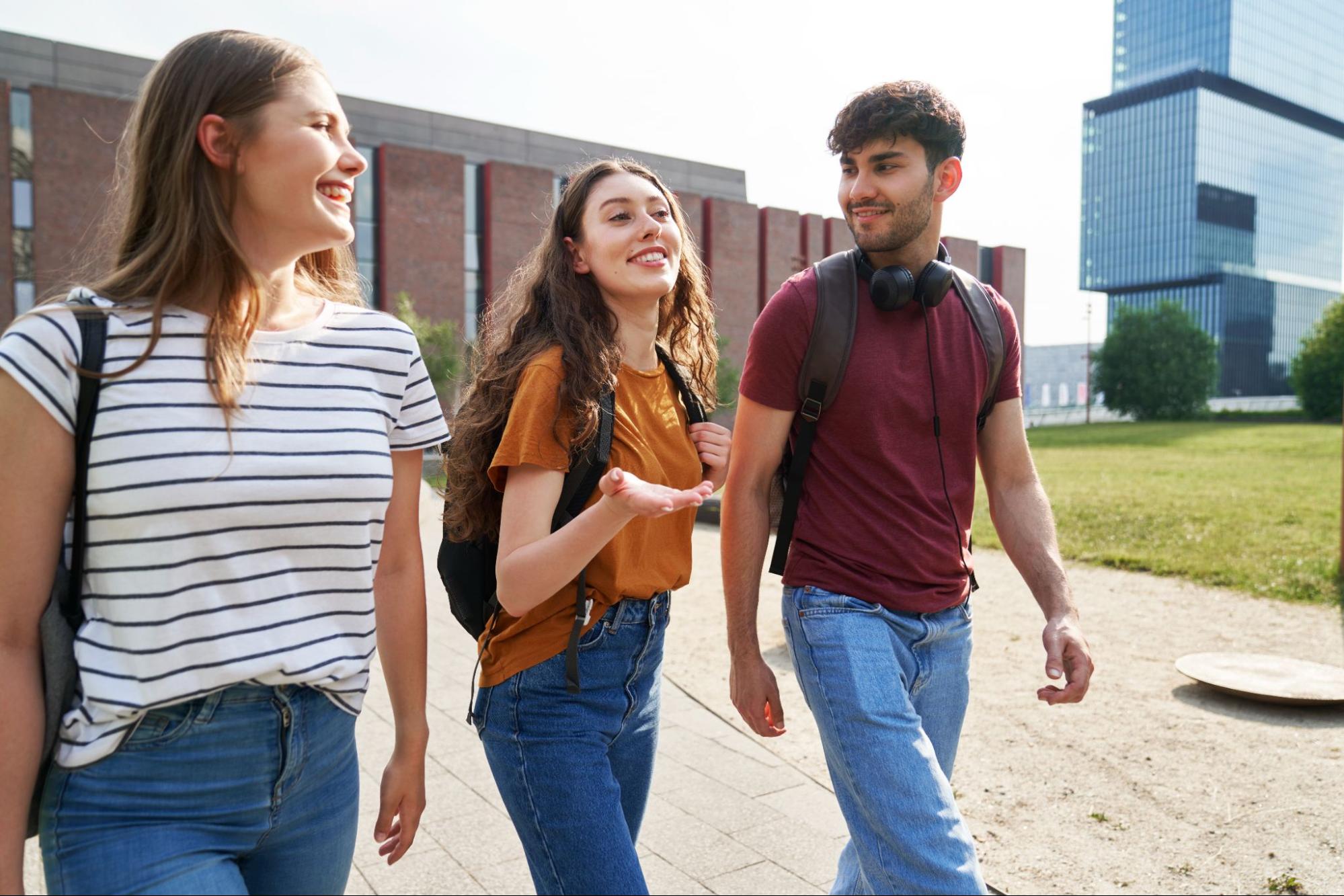 University students walking and chatting near student accommodation in Loughborough