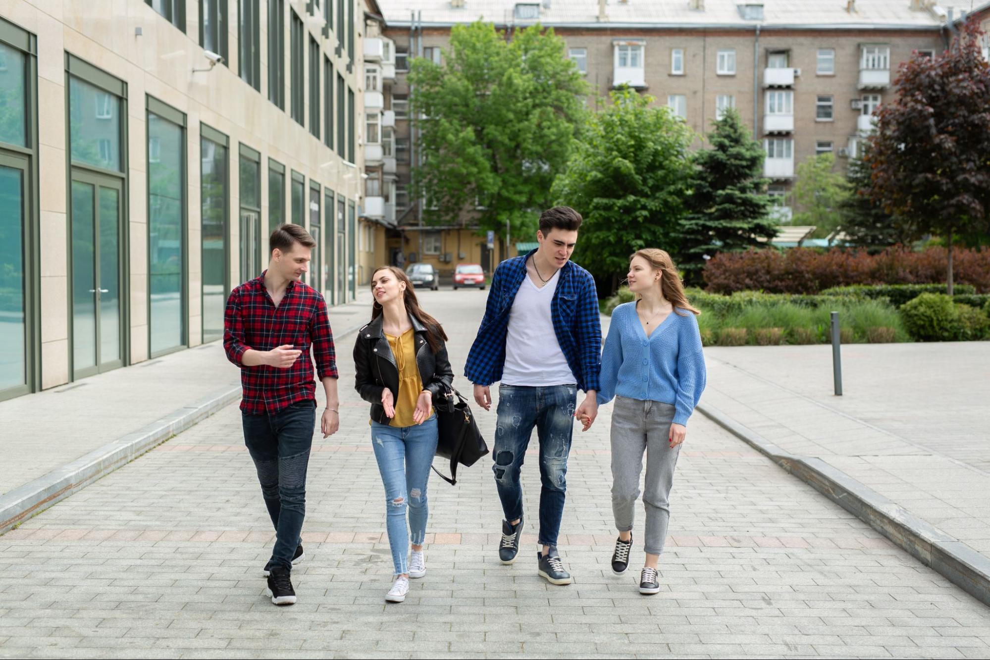 A group of university students walking together near the student accommodation in Exeter city centre
