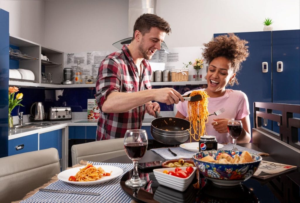 Students enjoying food in the Luxe Lounge at Study Inn’s Lemyngton Street student accommodation in Loughborough