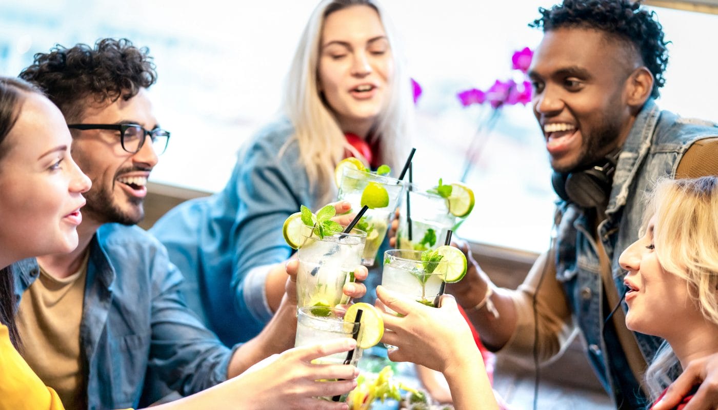 Students enjoying drinks together at Study Inn Bristol social event, making friends in a vibrant student community