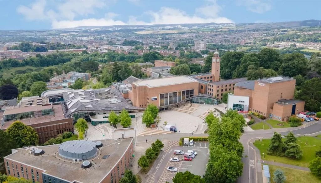 Aerial view of the University campus surrounded by greenery and the city of Exeter, popular with students living in Exeter student accommodation.